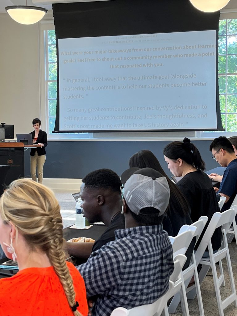 Emily Donahoe and graduate students at a workshop